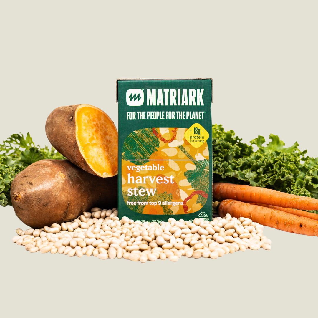 Matriark Foods Vegetable Harvest Stew placed around dried beans, sweet potatoes, kale and carrots