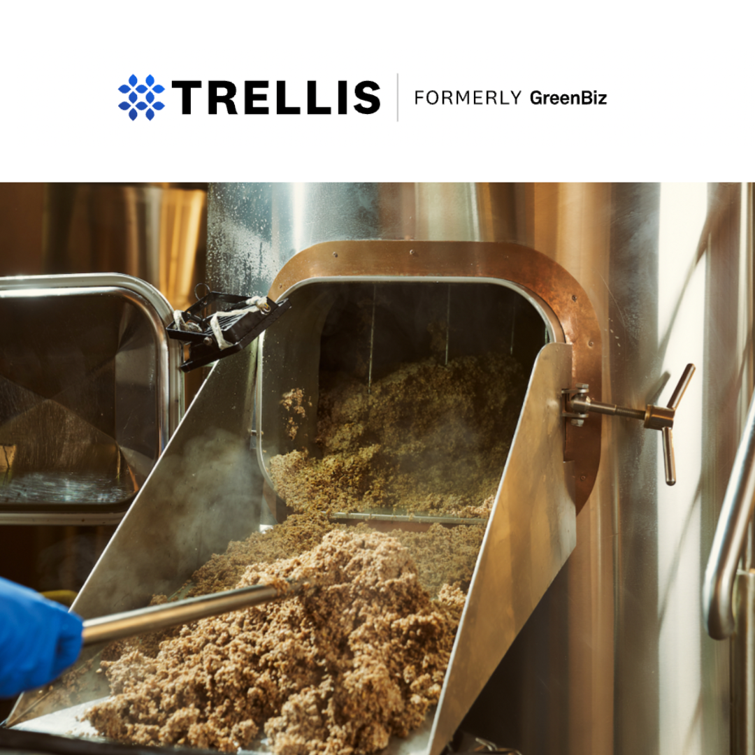 Trellis logo with a photo of spent grain being removed from a machine